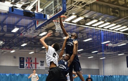 Basketball game showing players from CoLA Southwark Pride basketball team scoring a point